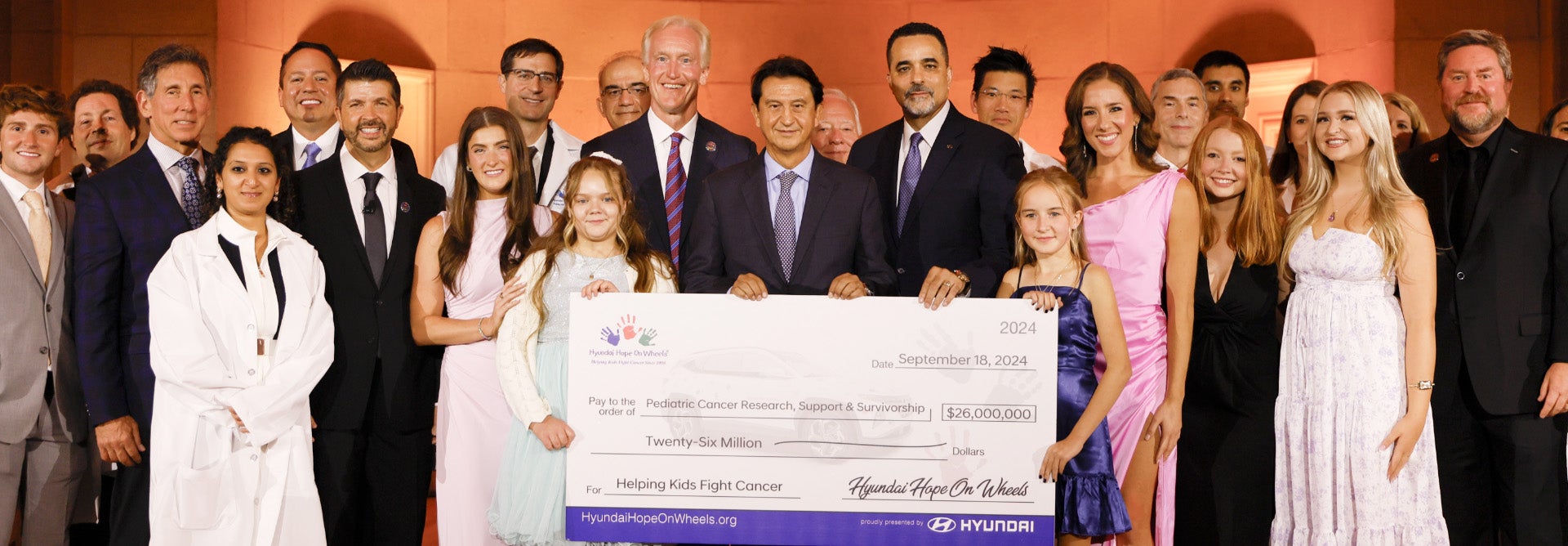 helping kids fight cancer foundation showing their big check from hyundai hope on wheels - Homer Skelton Hyundai in Olive Branch MS