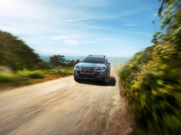 Hyundai Elantra rushing down dirt road