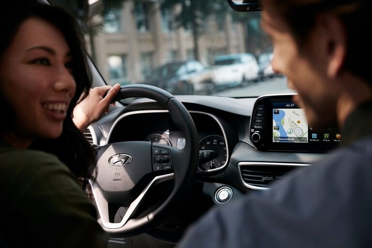 Interior view of a Hyundai vehicle from the rear view POV facing forward.