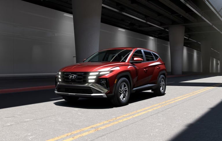 Three quarters view of Hyundai Tucson drving down road